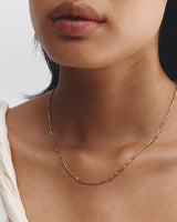 Model wearing ember necklace in yellow gold