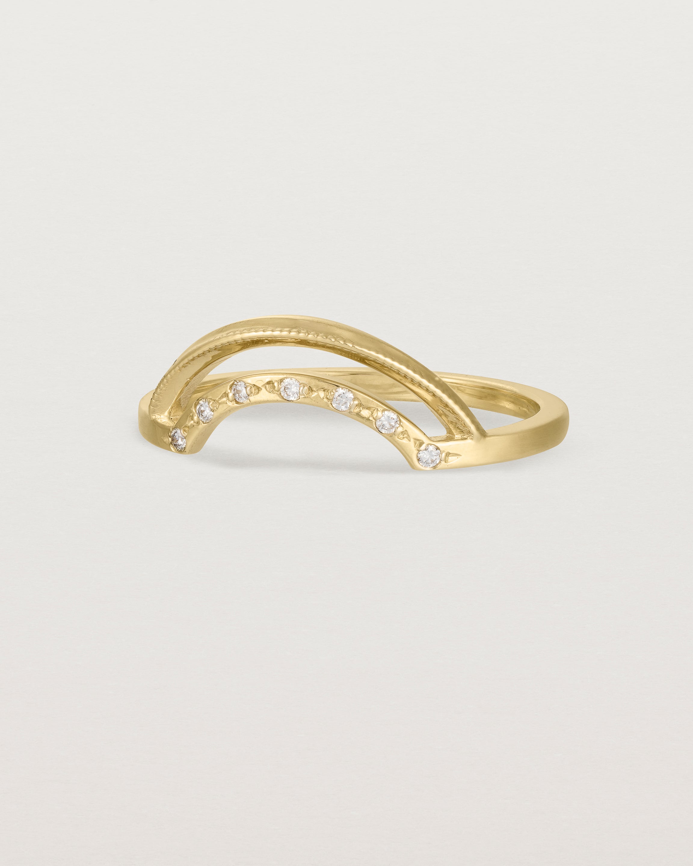 Fit three of a double arc crown ring with white diamonds adoring the inner arc - crafted in yellow gold.