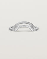 Fit four of a double arc crown ring with white diamonds adoring the inner arc - crafted in white gold.