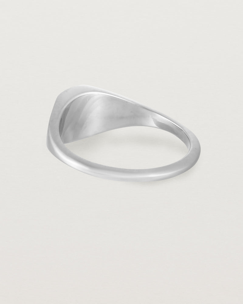 Back view of a simple signet with an elongated rectangular face in sterling silver.