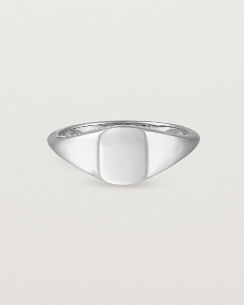 Front view of a simple signet with an elongated rectangular face in sterling silver.