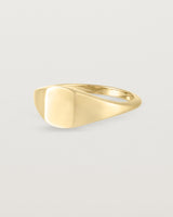 Back view of a simple signet with an elongated rectangular face in yellow gold