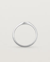 Standing view of a simple signet with an elongated rectangular face in sterling silver.