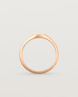 Standing view of a simple signet with an elongated rectangular face in rose gold
