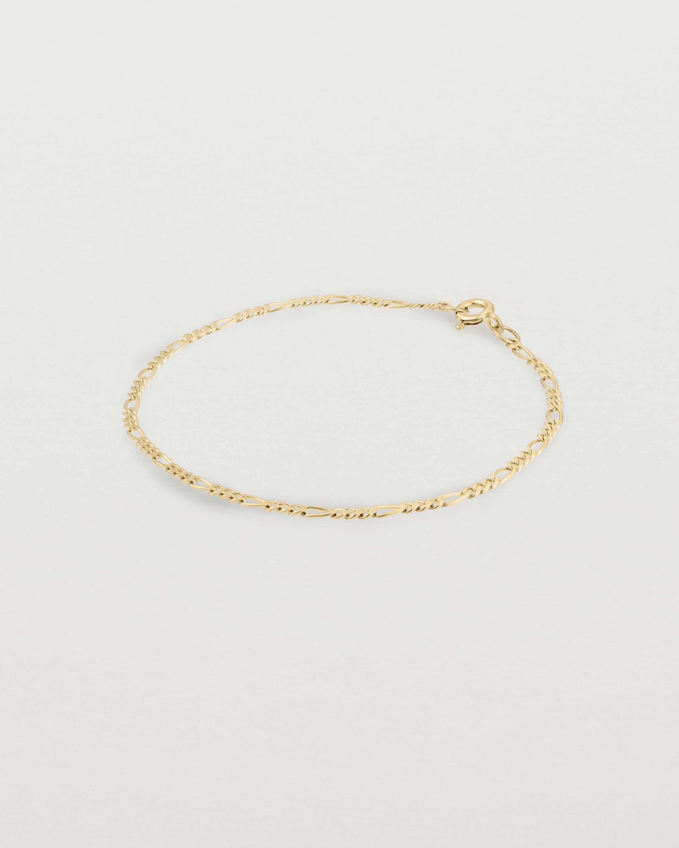 Our signature figaro chain in yellow gold