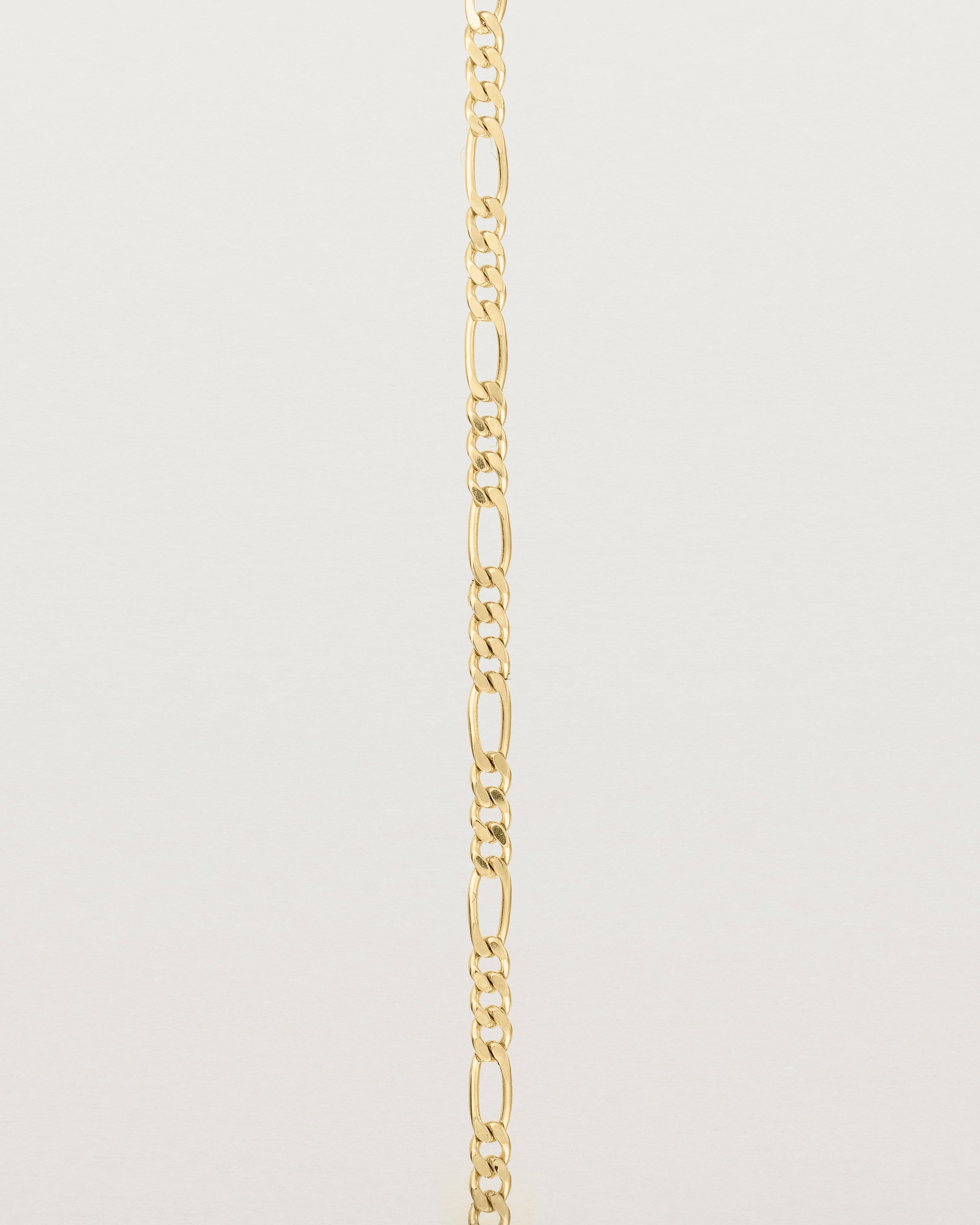 Our signature figaro chain in yellow gold