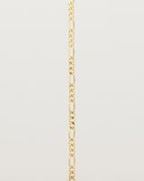 Our signature figaro chain in yellow gold