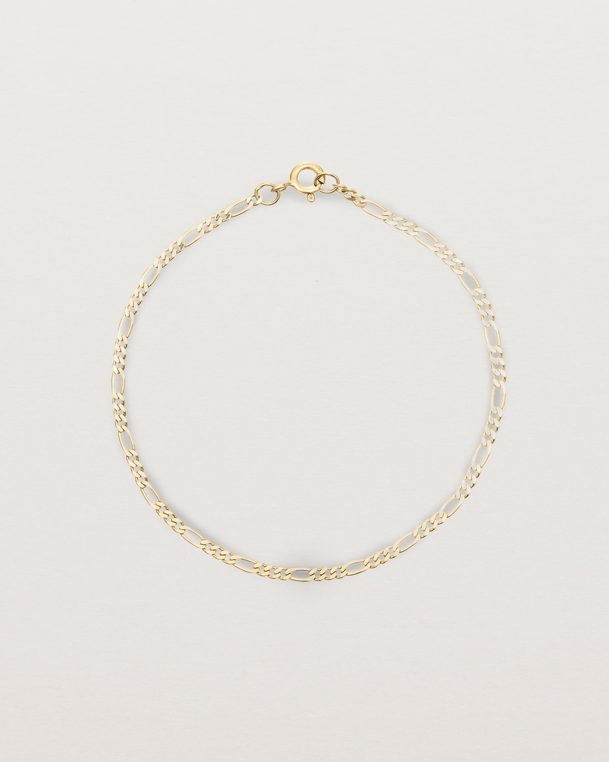 Our signature figaro chain in yellow gold