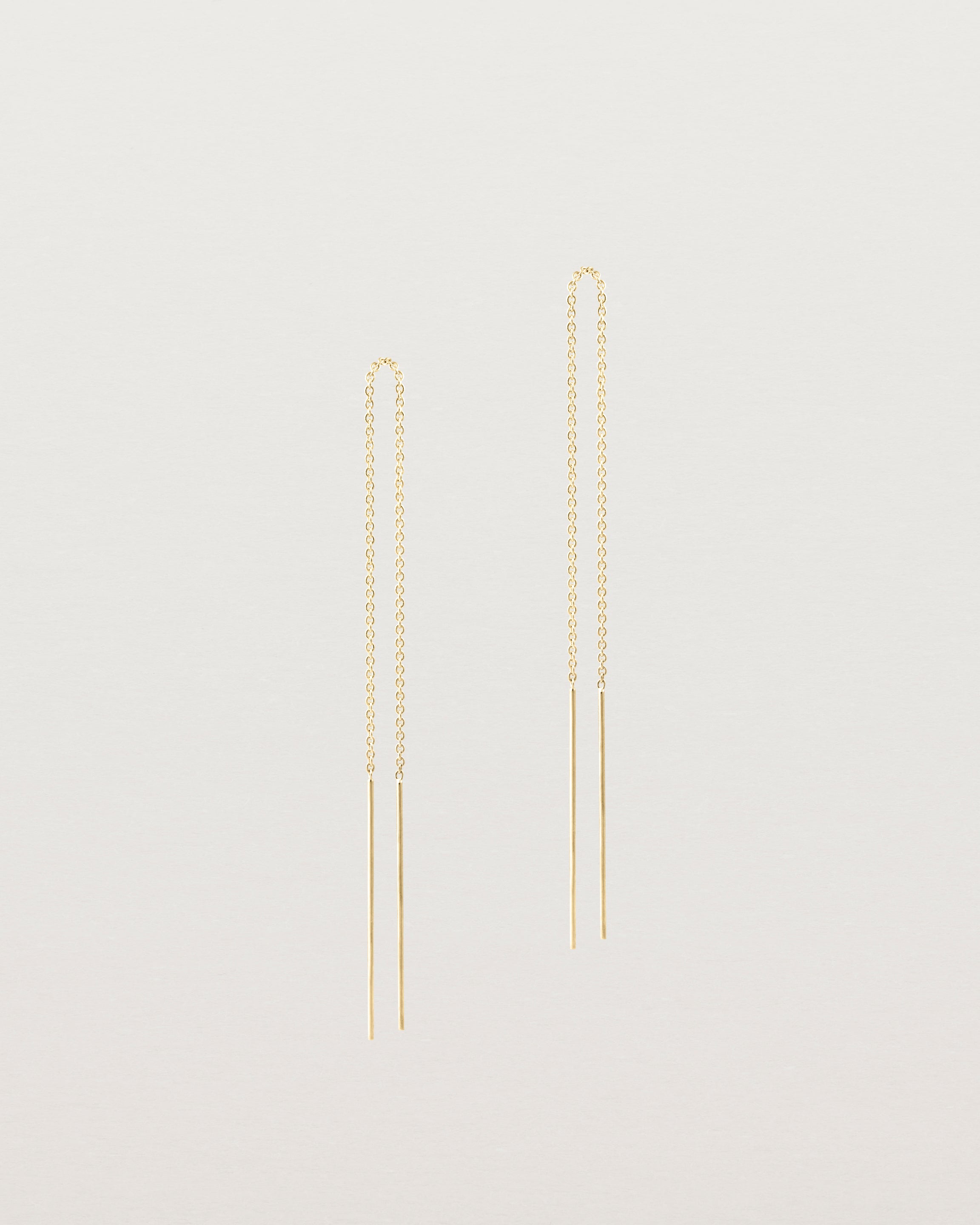 Front view of the eve threader earrings in yellow gold