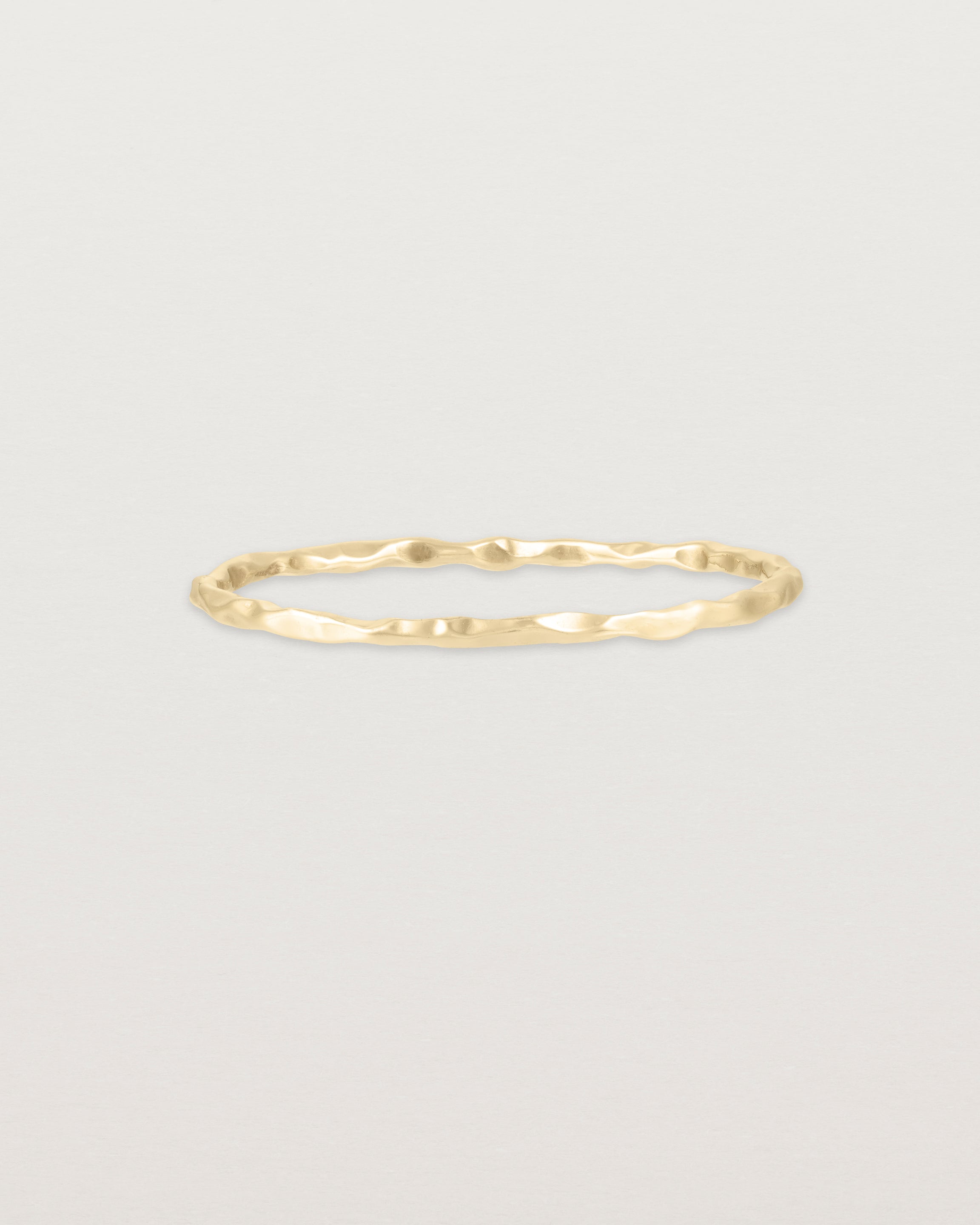 Front view of the Fine Faceted Stacking Ring | Yellow Gold.