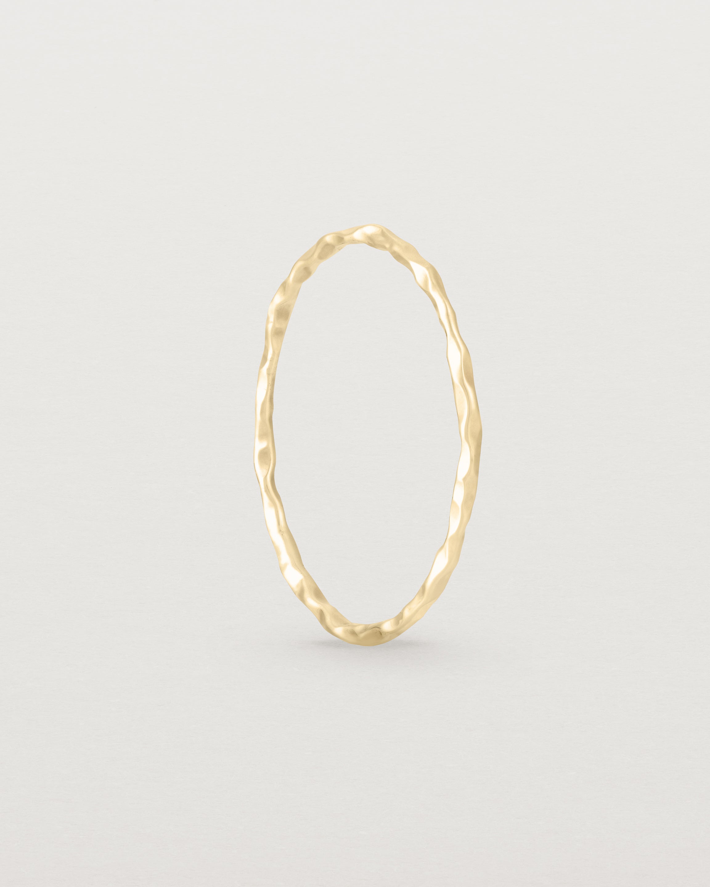 Standing view of the Fine Faceted Stacking Ring | Yellow Gold.