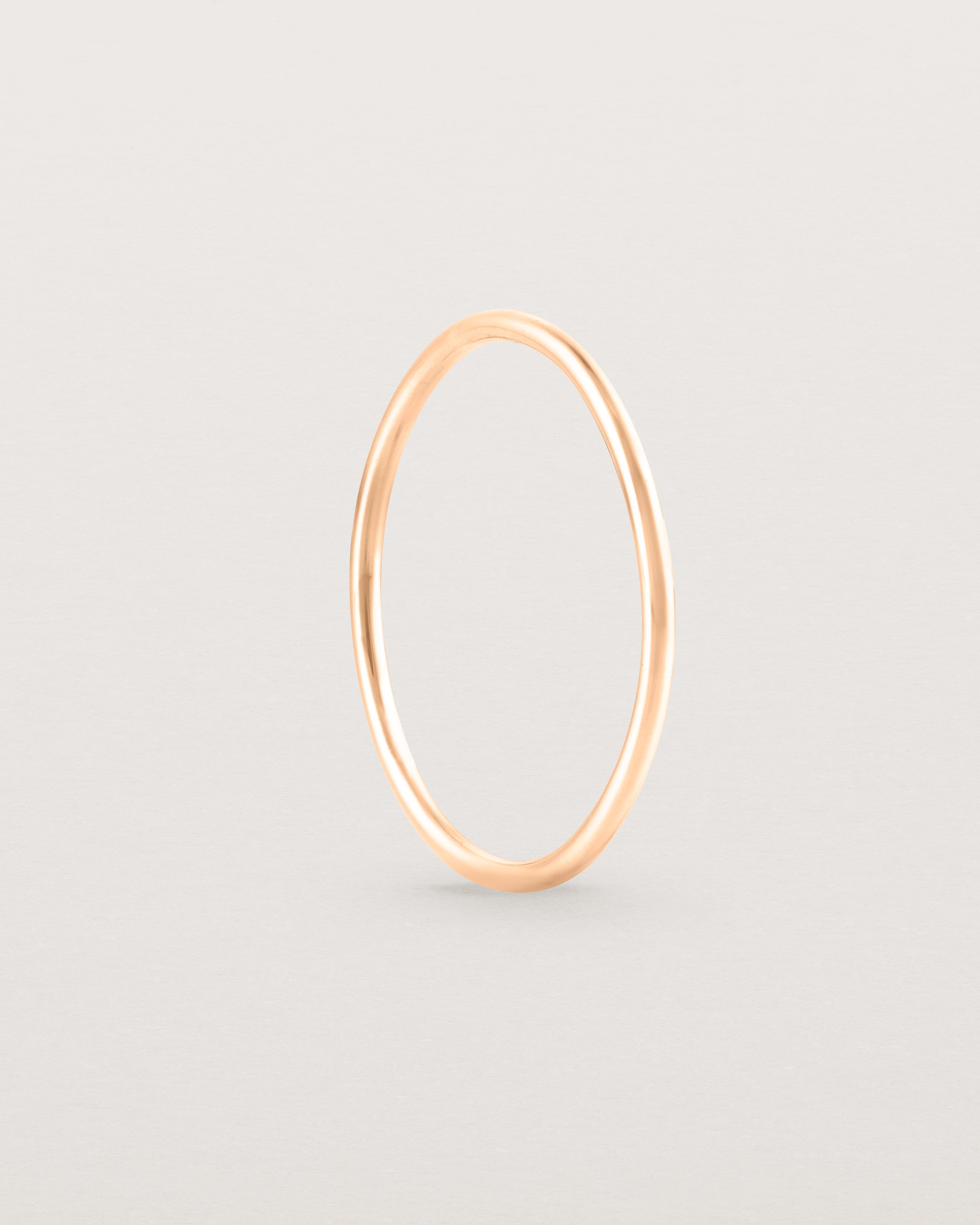 Standing view of the Fine Stacking Ring in rose gold.