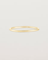 Front view of the Fine Stacking Ring in yellow gold.