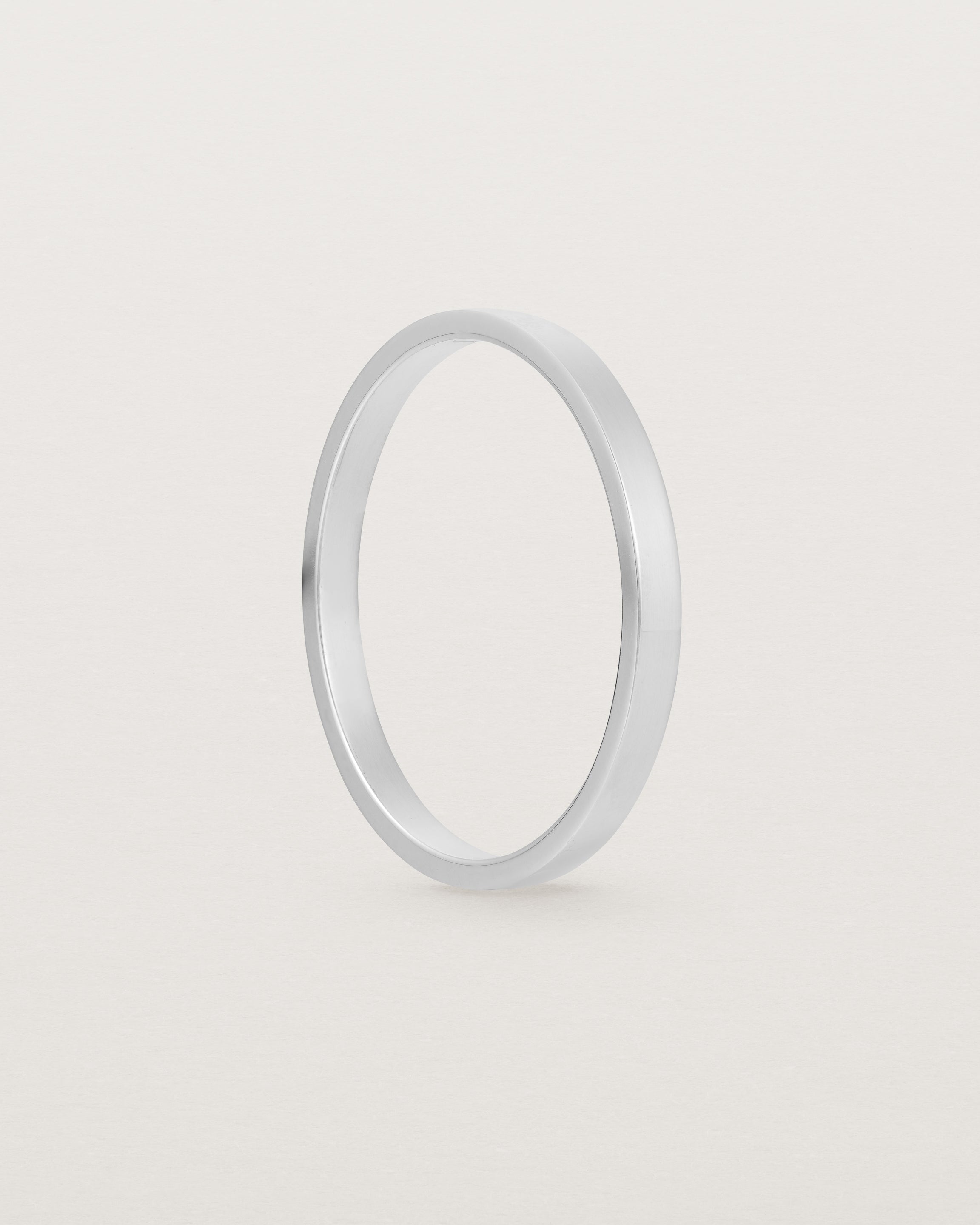 The side profile of our square profile, flat wedding band crafted in sterling silver