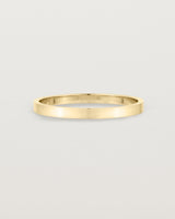 Our square profile, flat wedding band crafted in yellow gold