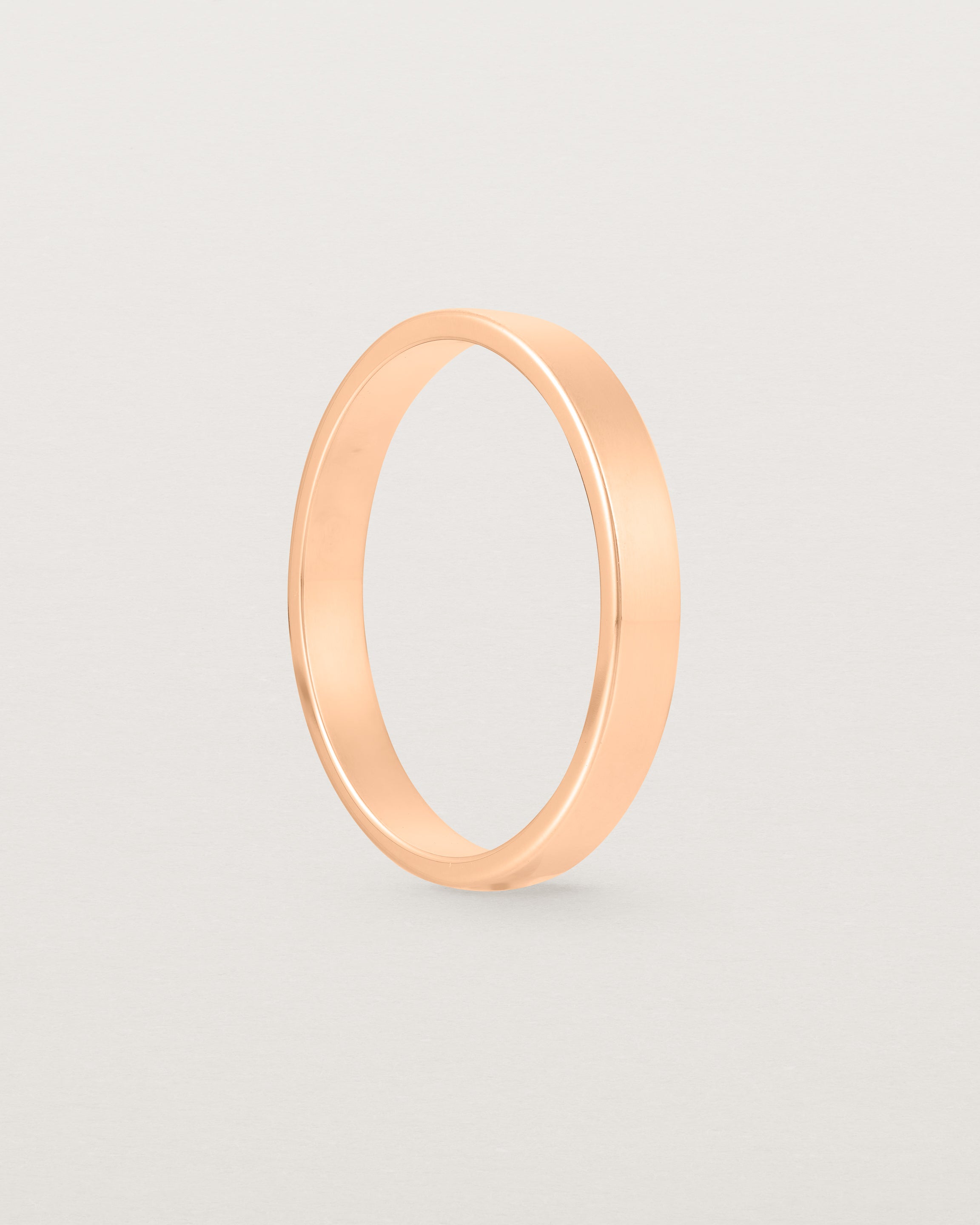 The side profile of our square, flat  3mm profile wedding band crafted in yellow gold