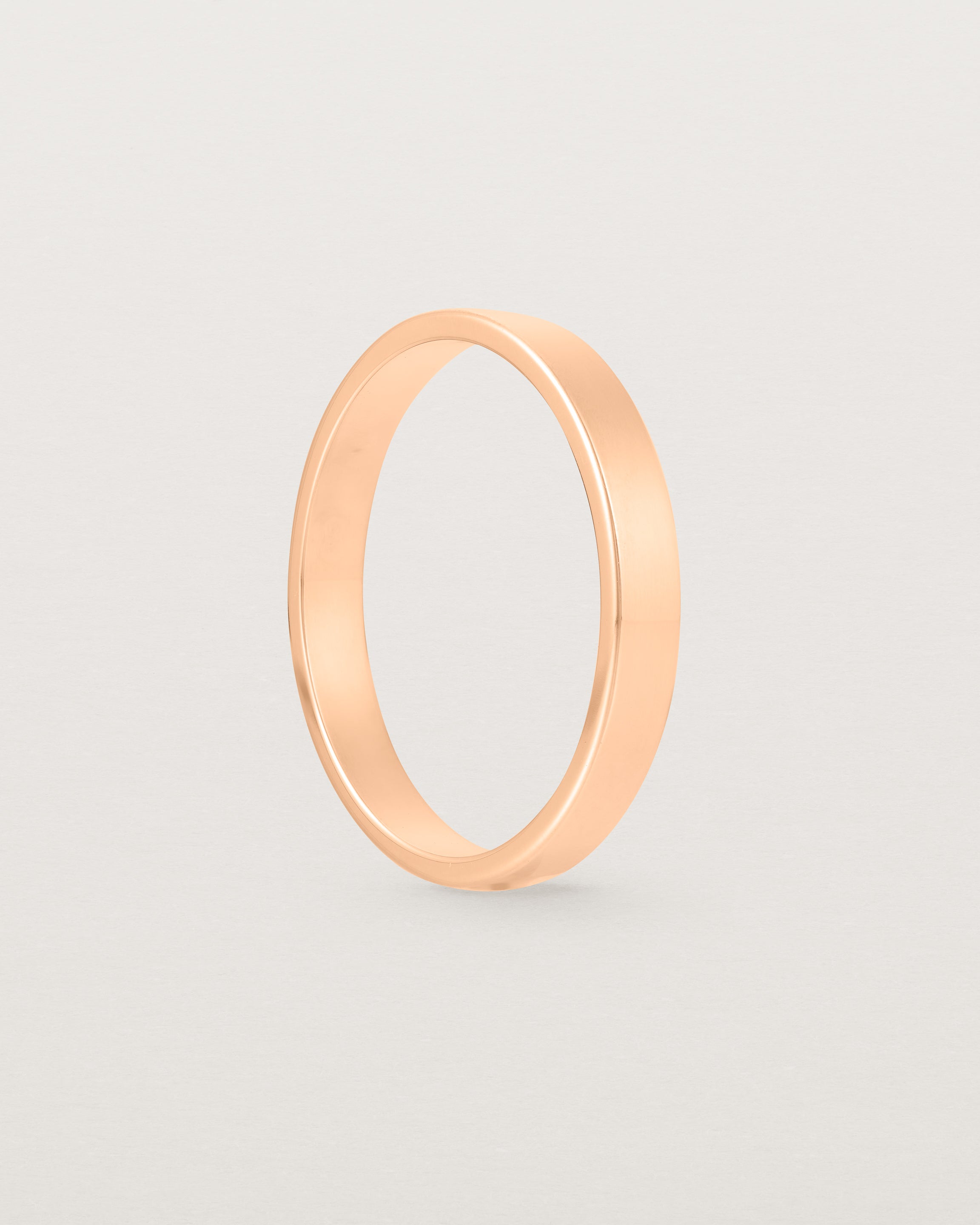 The side profile of our square, flat  3mm profile wedding band crafted in yellow gold