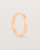 The side profile of our square, flat  3mm profile wedding band crafted in yellow gold