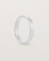 The side profile of our square, flat 3mm profile wedding band crafted in sterling silver
