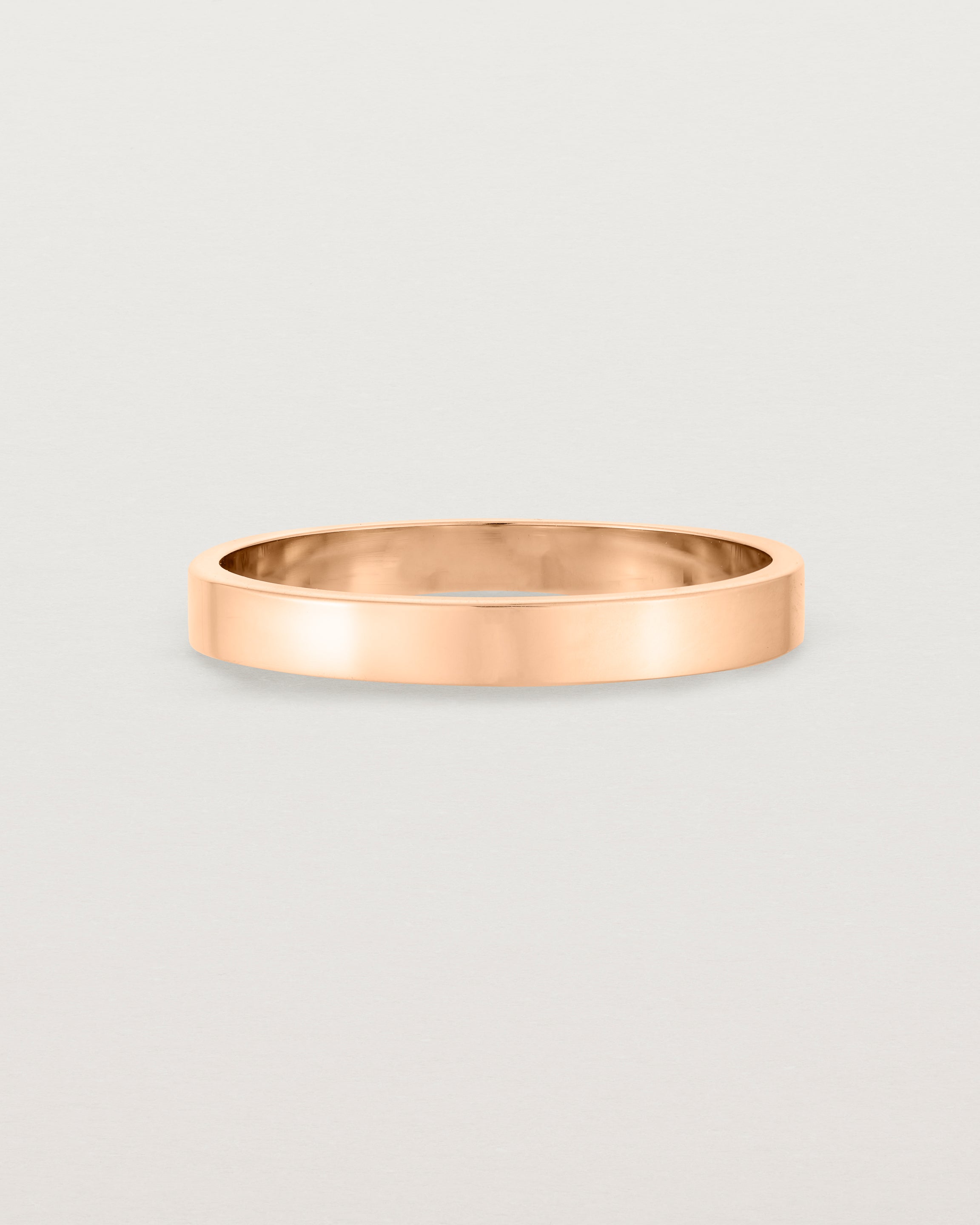 Our square, flat  3mm profile wedding band crafted in yellow gold