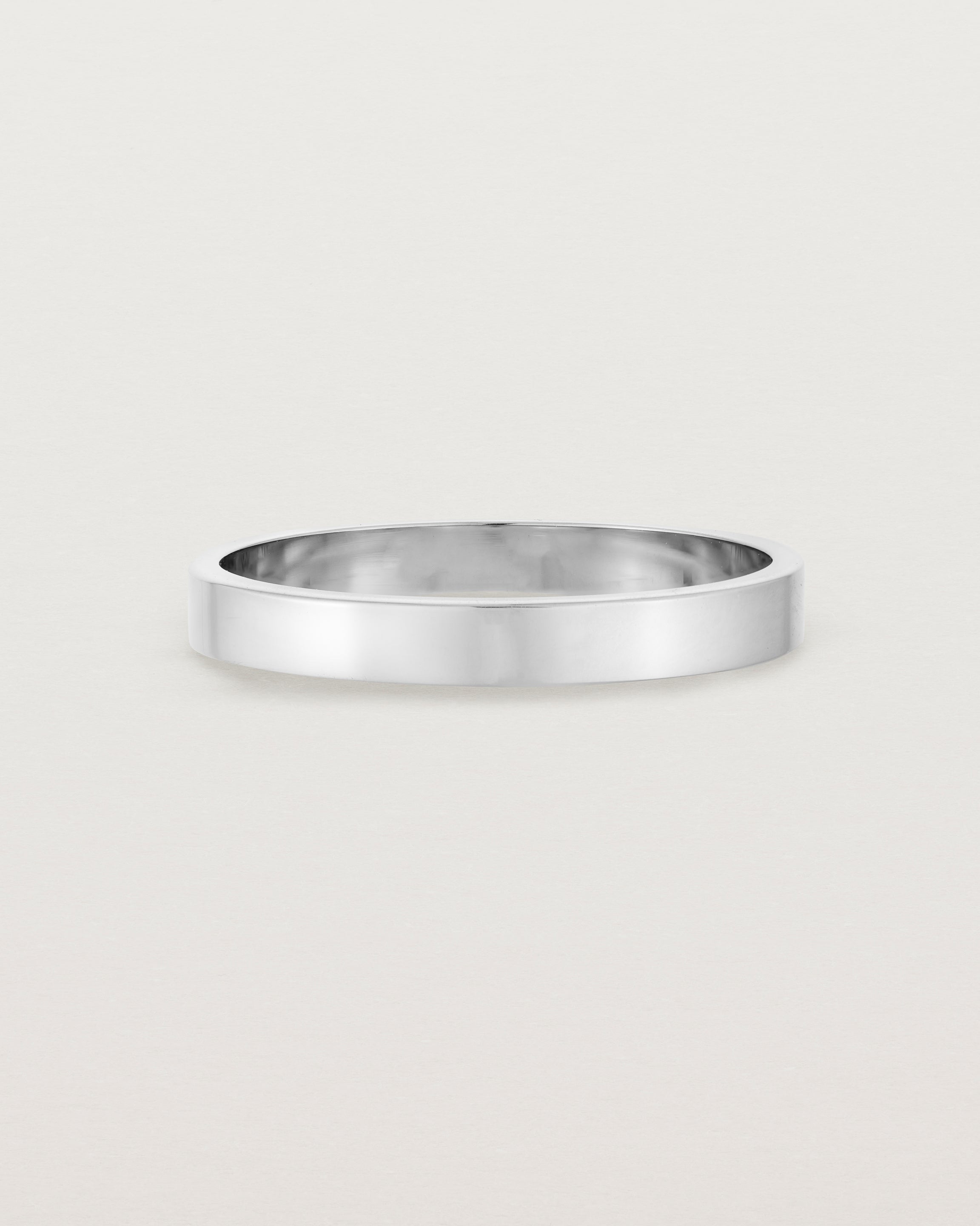 Our square, flat 3mm profile wedding band crafted in white gold