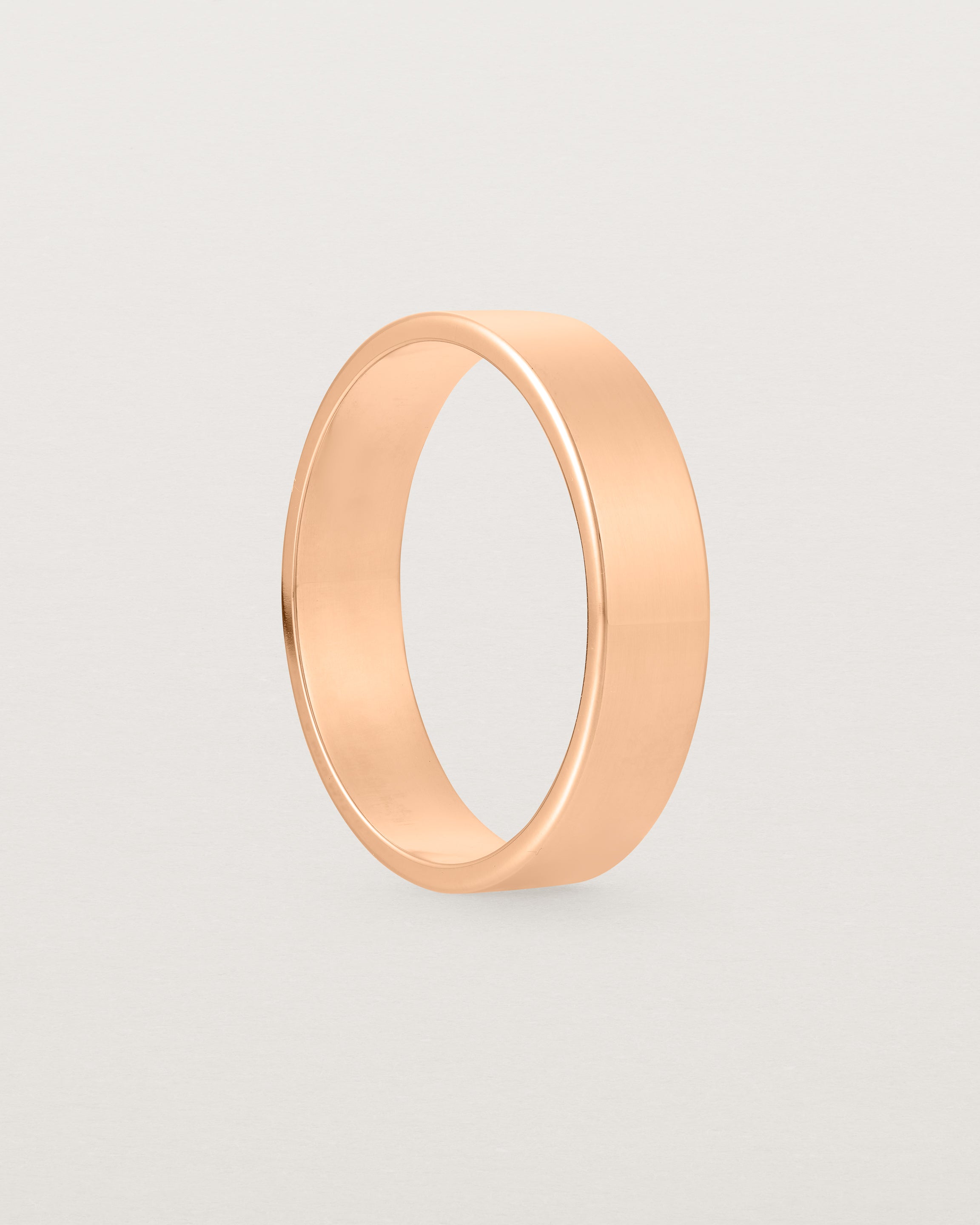 Side profile of our square, flat 5mm profile wedding band crafted in rose gold