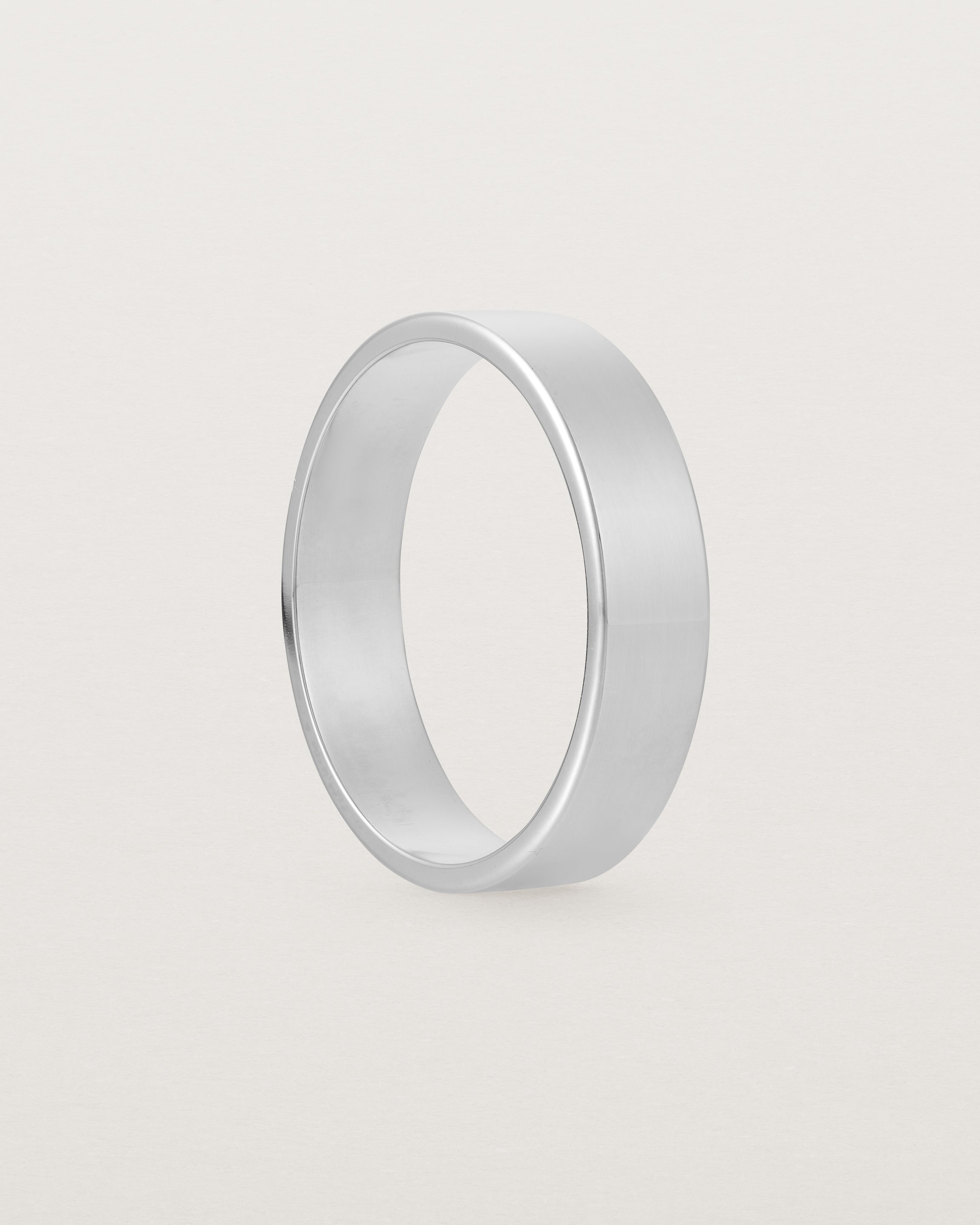 Side profile of our square, flat 5mm profile wedding band crafted in sterling silver