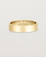 Our square profile, 5mm flat wedding band crafted in yellow gold