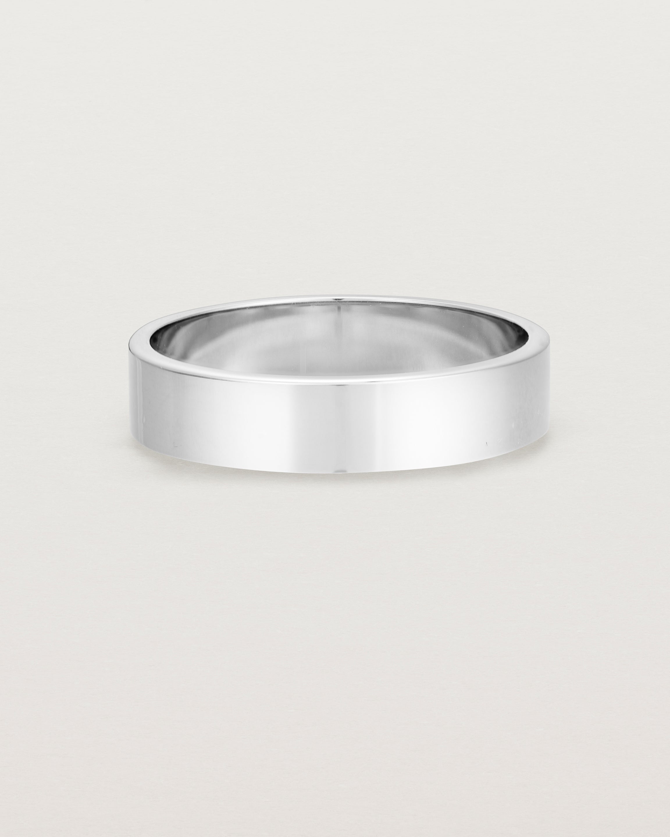 Our square profile, 5mm flat wedding band, crafted in white gold