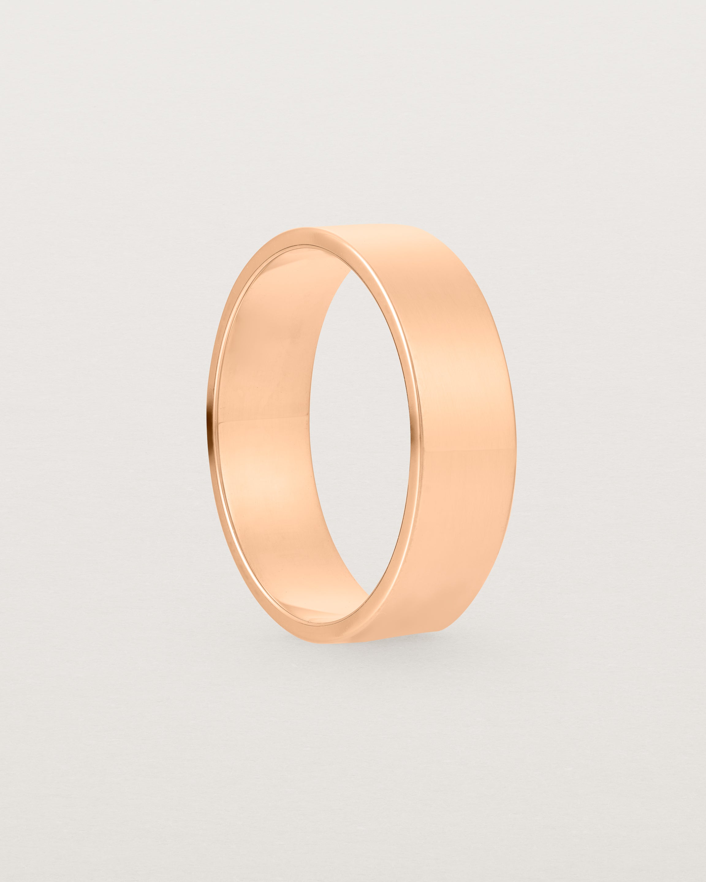 Side view of our square profile, 6mm flat wedding band crafted in rose gold