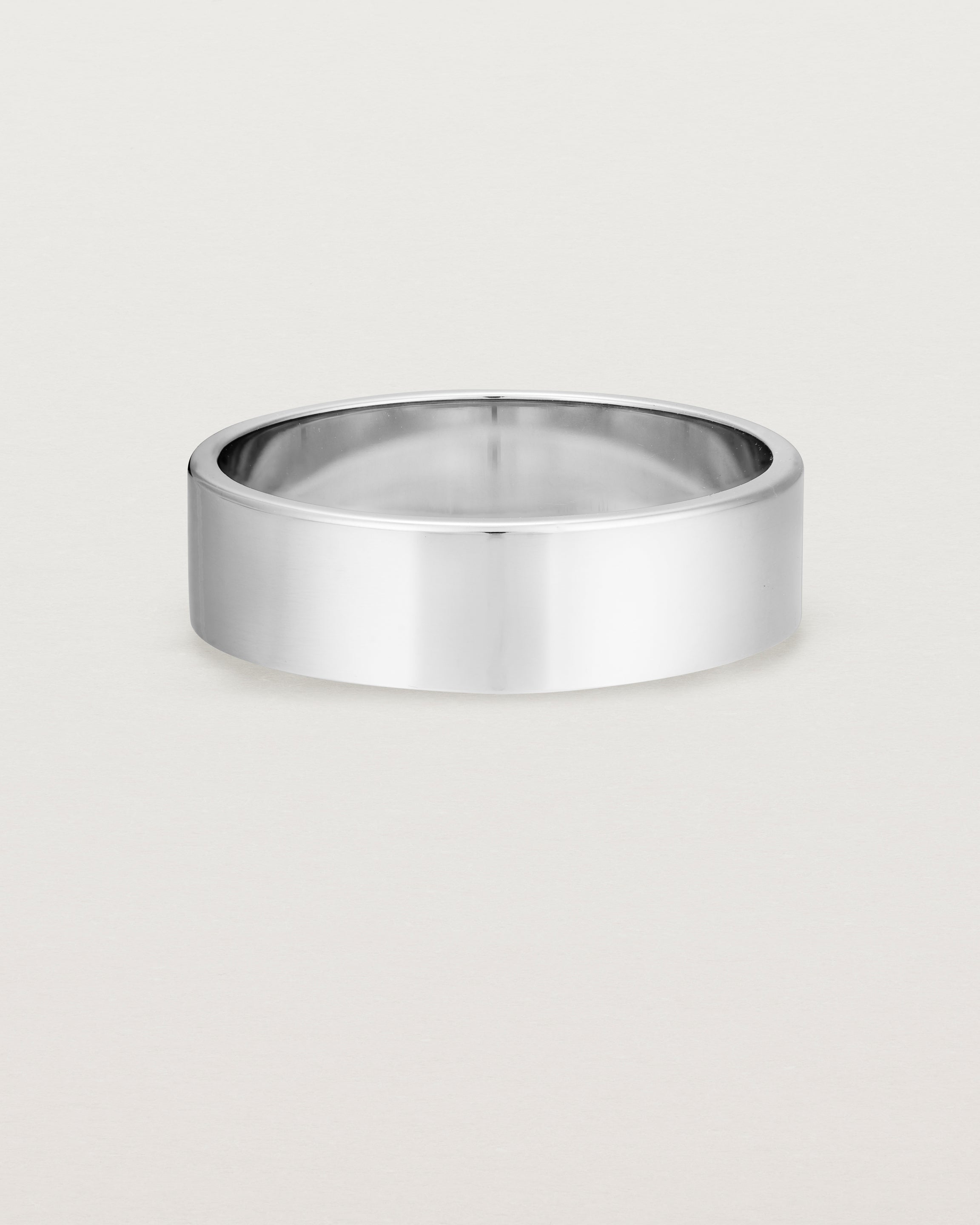 Our square profile, 6mm flat wedding band crafted in white gold