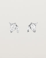 A pair of white gold studs featuring two marquise and one round diamond