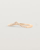 Side view of our white diamond gentle point ring in rose gold