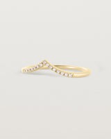 Side view of our white diamond gentle point ring in yellow gold
