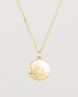 Close up view of the Golden Wattle Locket in yellow gold.