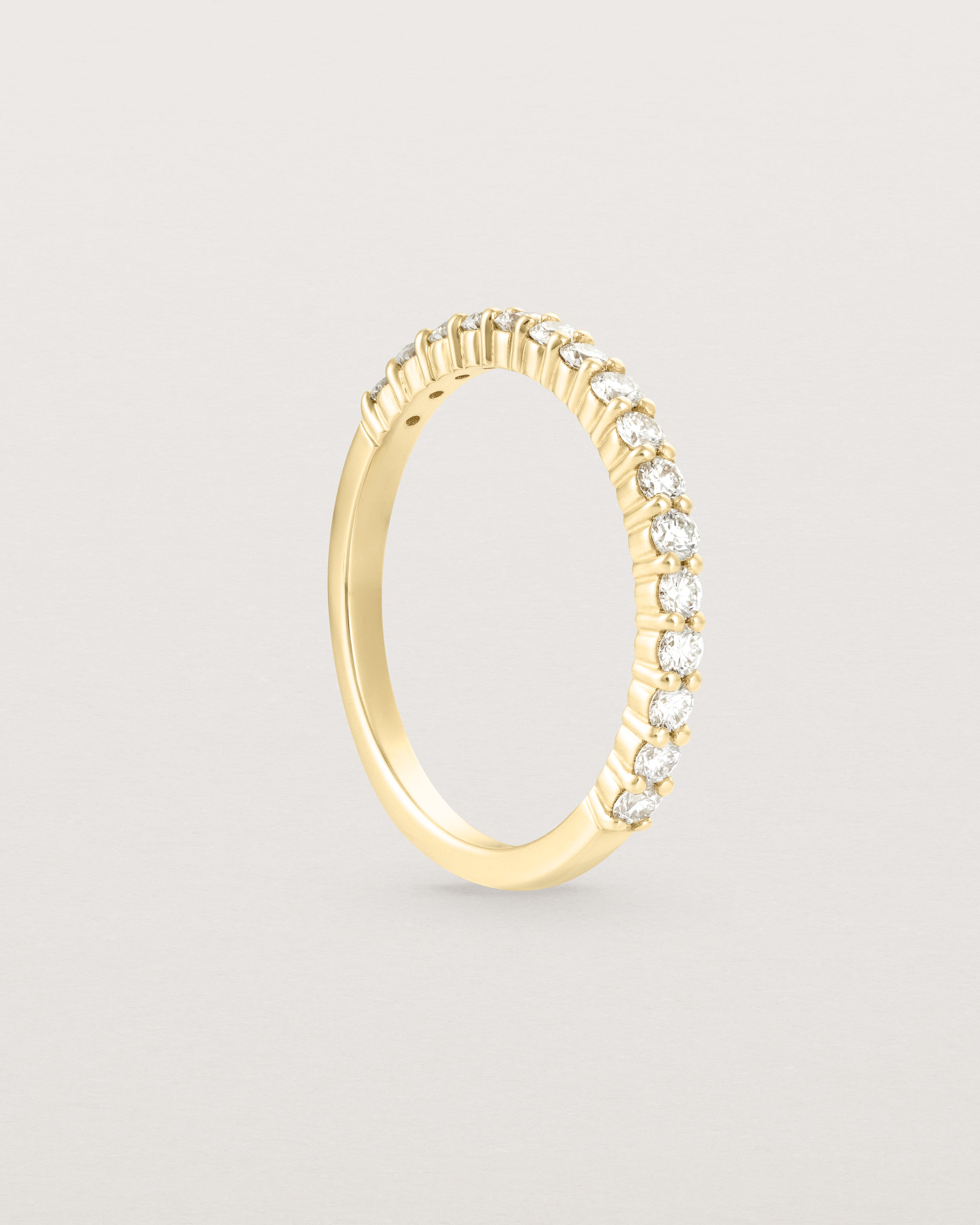 Standing view of the Demi Grace Ring | White Diamonds in yellow gold.