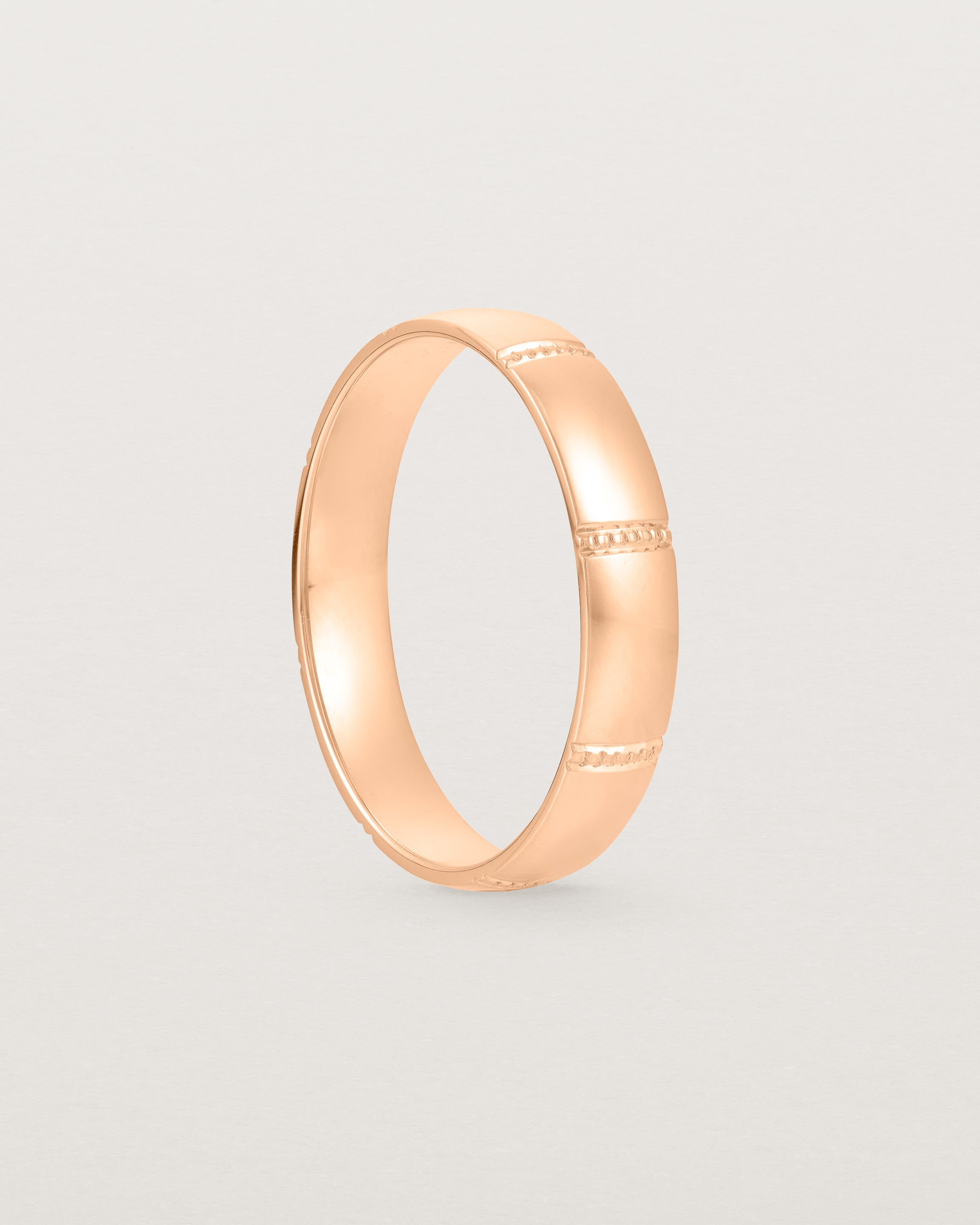 Standing view of the Grain Wedding Ring | 4mm | Rose Gold.
