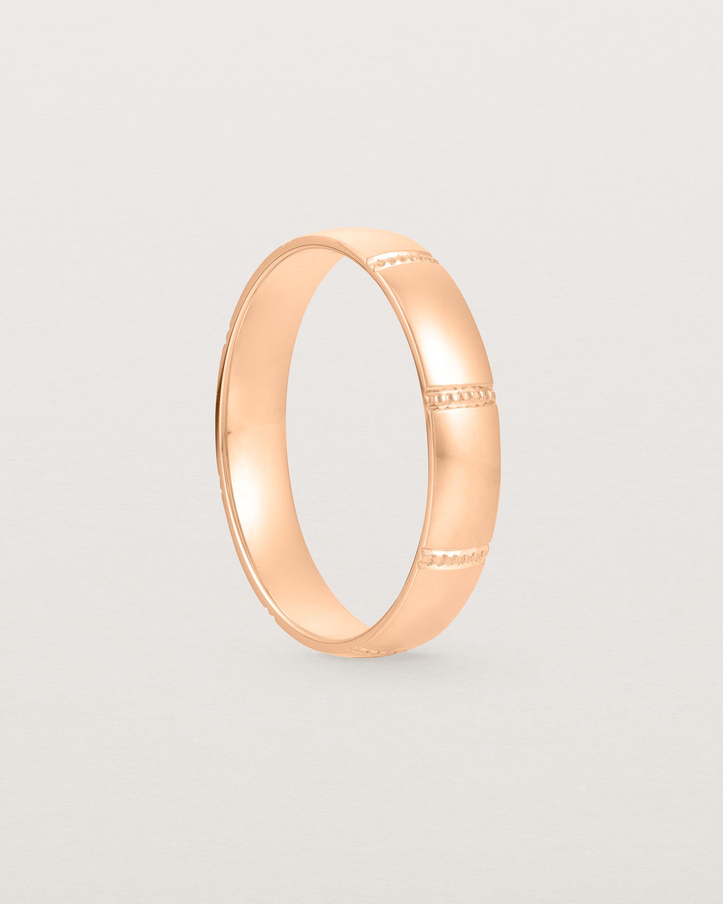 Standing view of the Grain Wedding Ring | 4mm | Rose Gold.