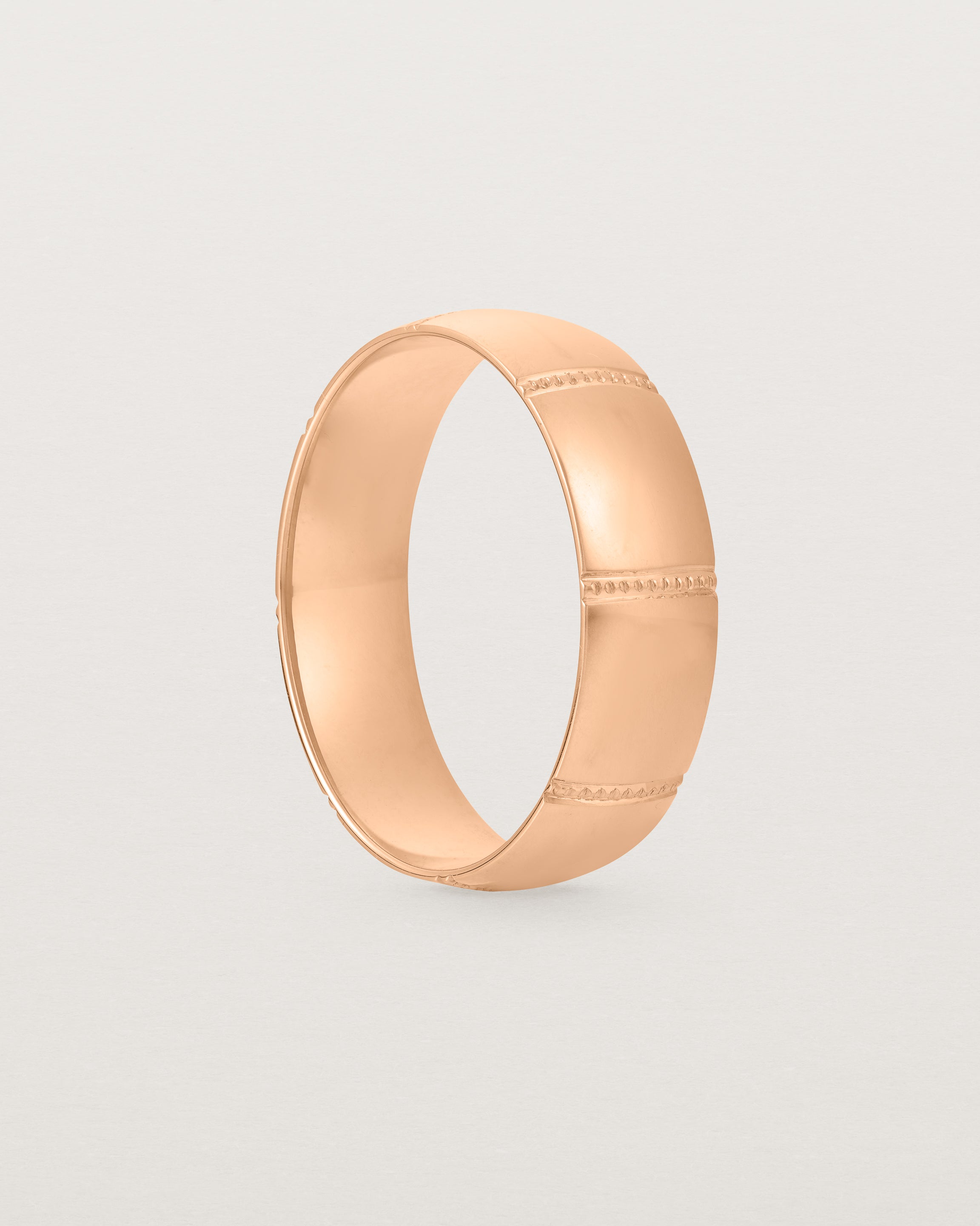 Standing view of the Grain Wedding Ring | 6mm | Rose Gold.
