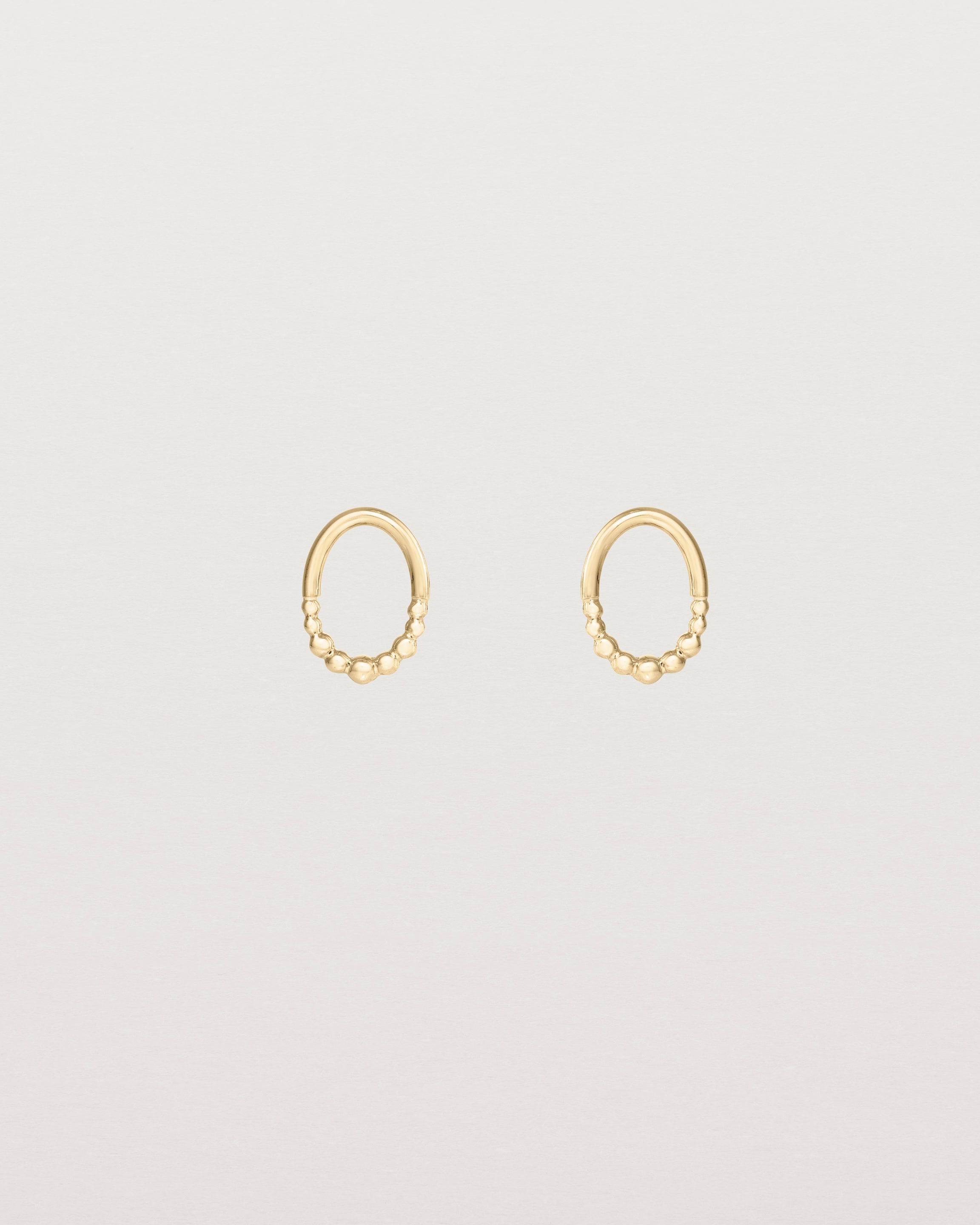 Front view of the Indra Studs in yellow gold.