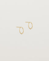 Angled view of the Indra Studs in yellow gold.