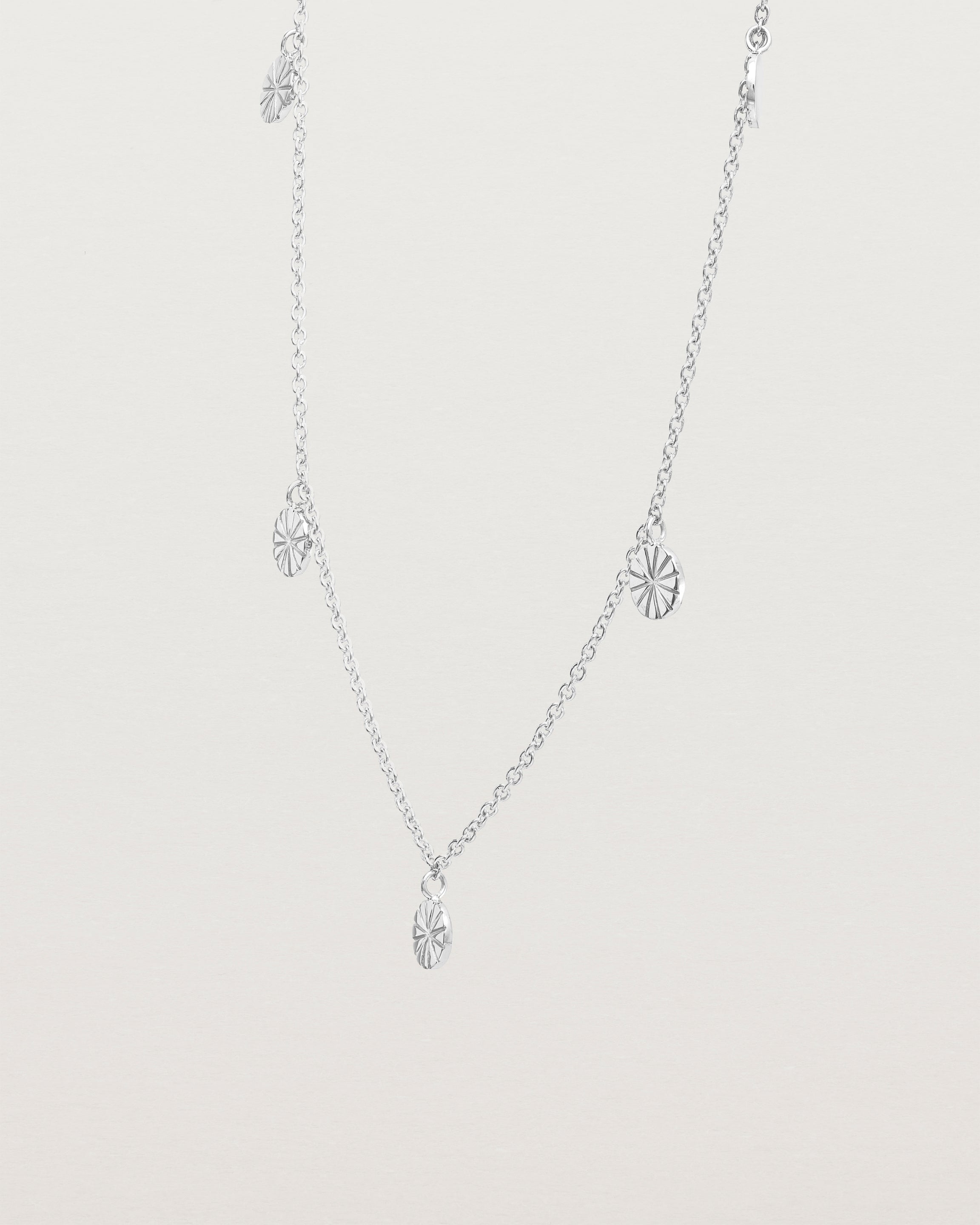 Angled view of the Jia Charm Necklace | Sterling Silver.