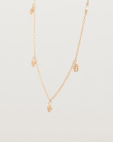 Angled view of the Jia Charm Necklace | Rose Gold.