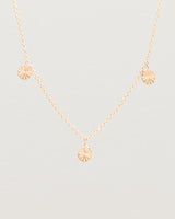 Close up view of the Jia Charm Necklace | Rose Gold.