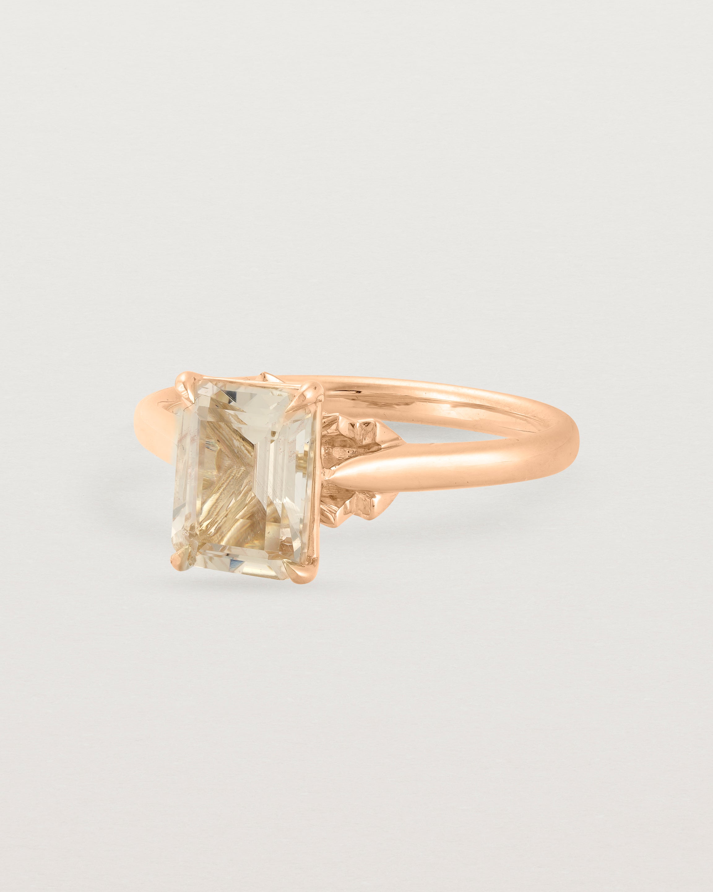 Angled view of the Kalina Emerald Solitaire | Savannah Sunstone | Rose Gold.