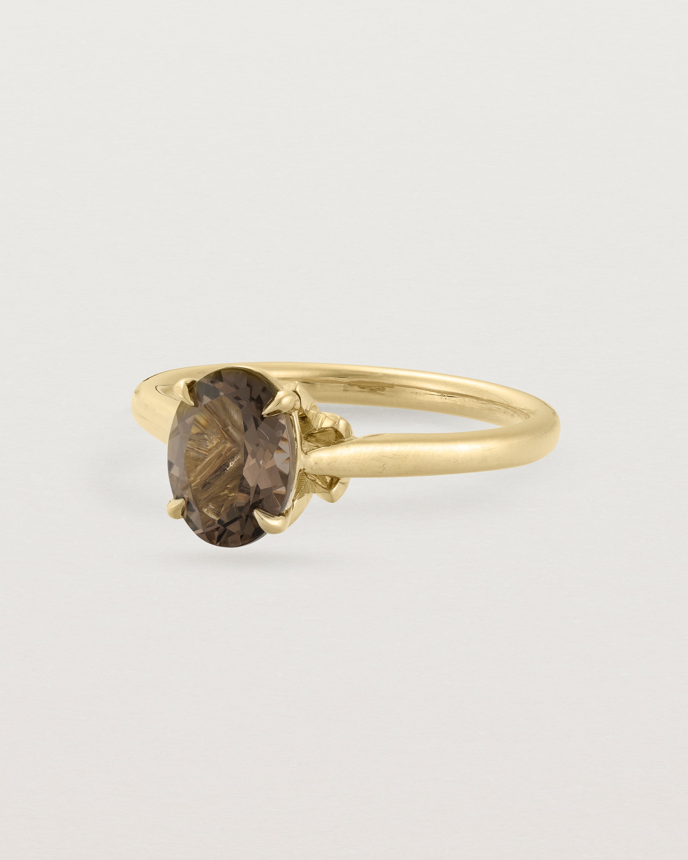 Angled view of the Kalina Oval Solitaire | Smokey Quartz | Yellow Gold.