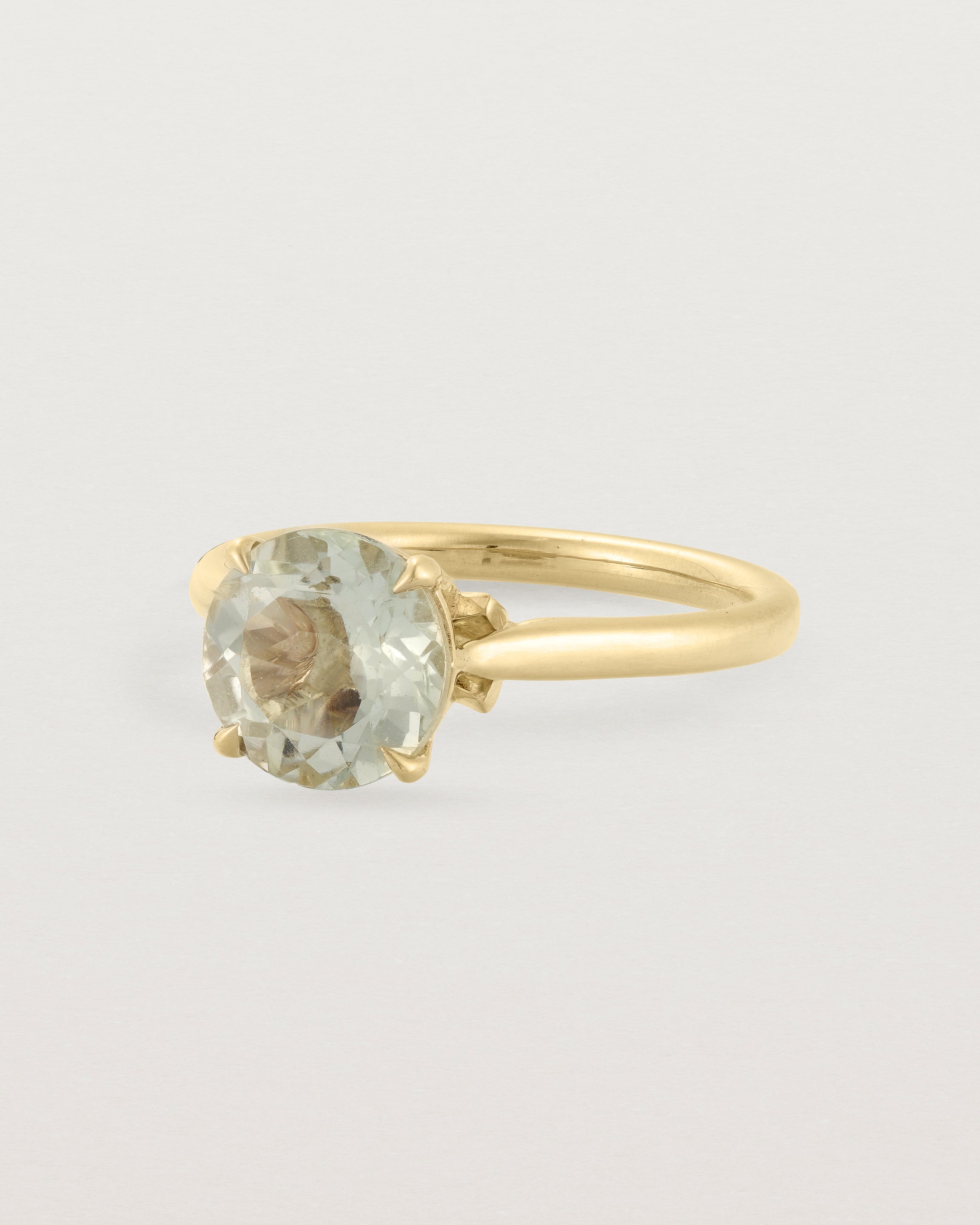 Angled view of the Kalina Round Solitaire | Green Amethyst | Yellow Gold.