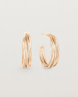 A pair of the Kamali Hoops in Rose Gold.