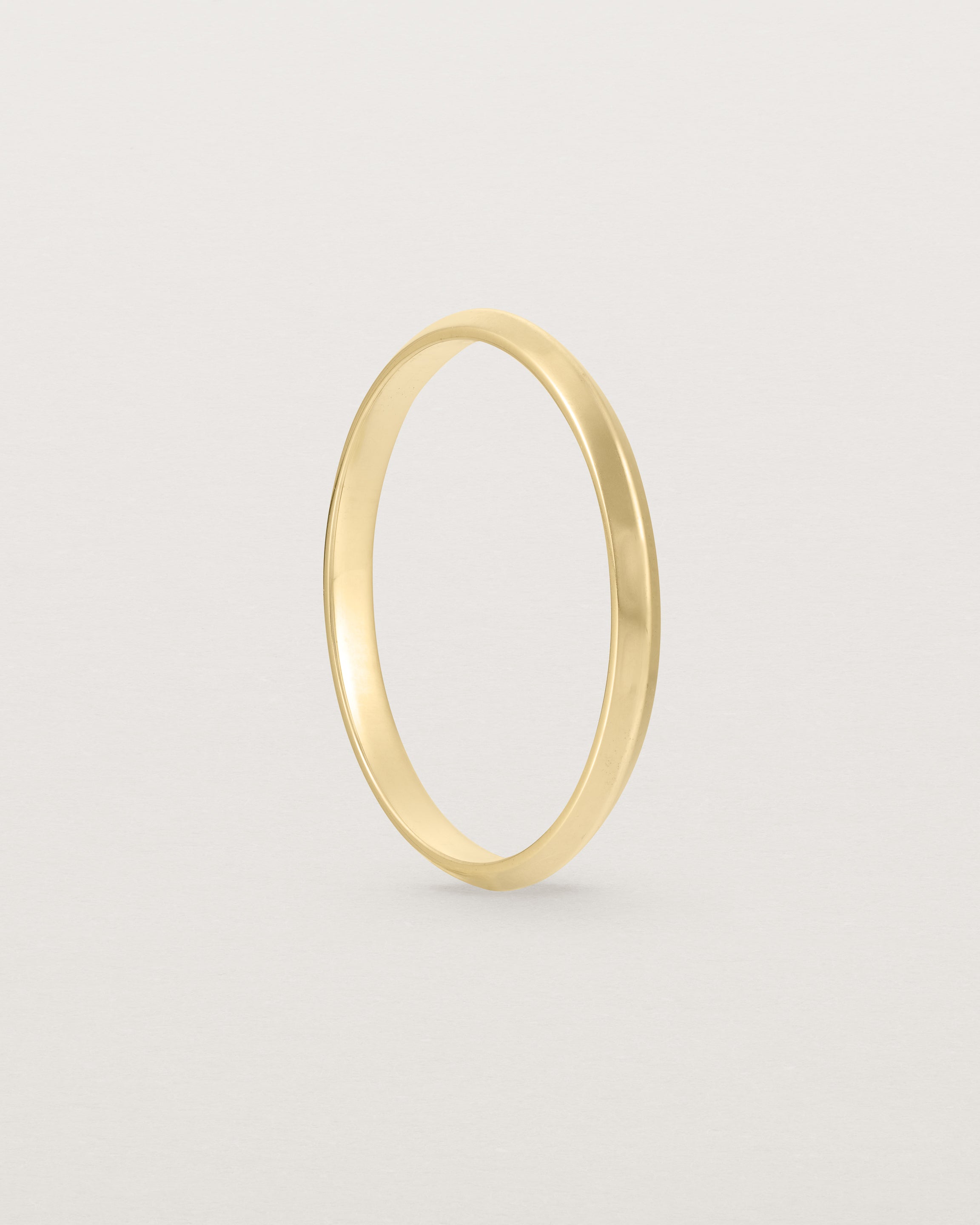 Standing view of the Knife Edge Wedding Ring | 2mm | Yellow Gold.