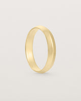 Standing view of the Knife Edge Wedding Ring | 4mm | Yellow Gold.